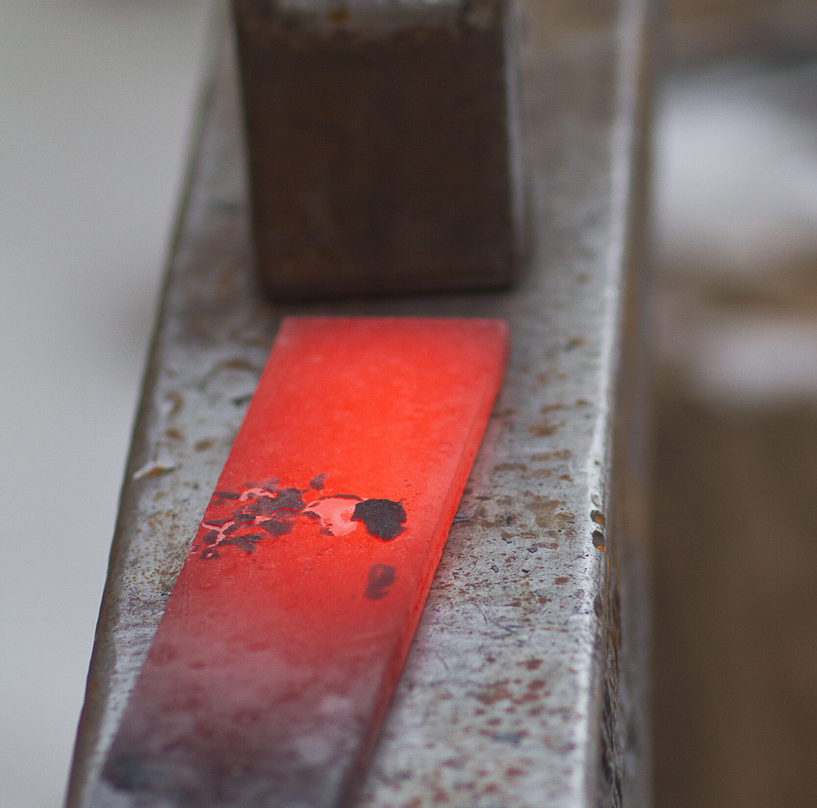 Heating the anvil with a large steel bar.