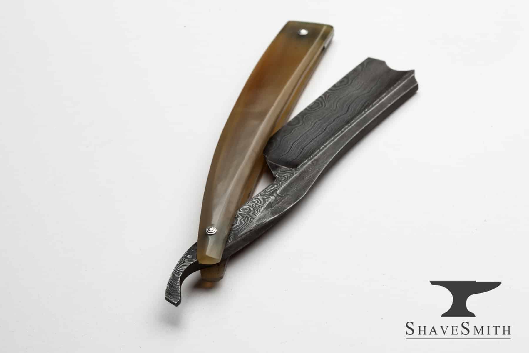 Blond ox horn damascus custom straight razor.